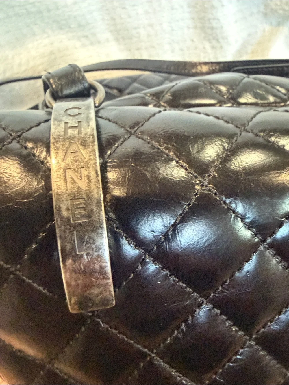 CHANEL Black Quilted Lambskin Drawstring Backpack with Chain